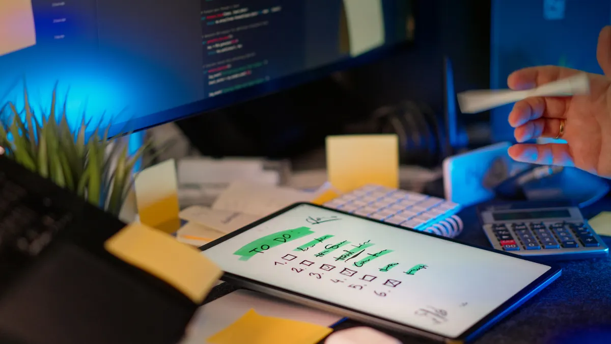 Content standards and editorial process — The Complete Guide Checklist on tablet beside a coding workspace