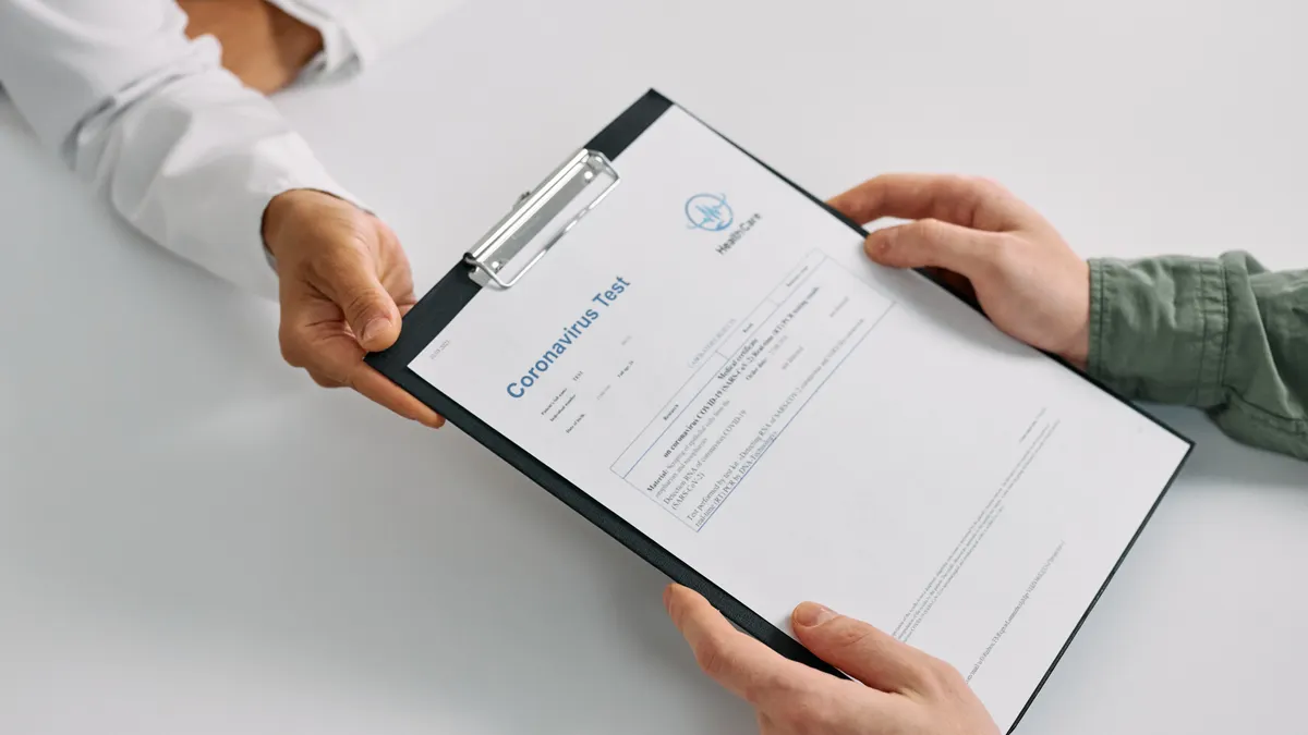 How tronicreview.com checks information before publishing Clipboard document being handed over
